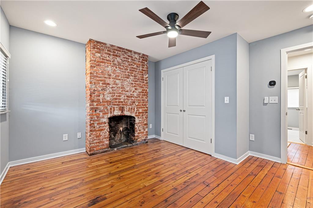 4808 Lima Way Pittsburgh, PA 15224 - Photo 15 of 26 a view of a livingroom with a fireplace a ceiling fan and wooden floor