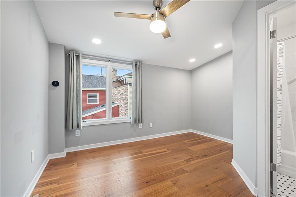 4808 Lima Way Pittsburgh, PA 15224 - Photo 19 of 26 an empty room with window and ceiling fan