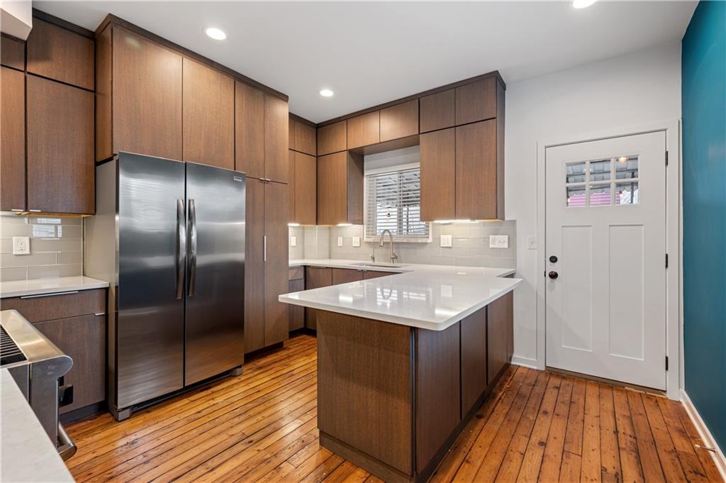 4808 Lima Way Pittsburgh, PA 15224 - Photo 2 of 26 a kitchen with a sink a refrigerator and wooden floor