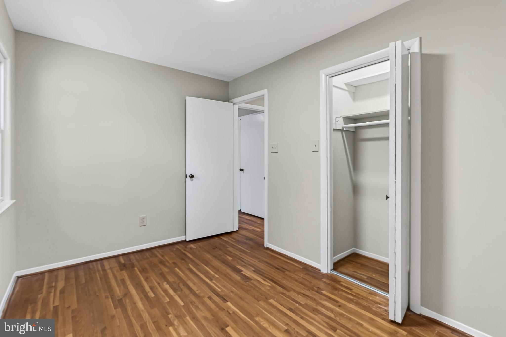 7604 Boulder Street Springfield, VA 22151 - Photo 12 of 39 a view of an empty room with closet and a window