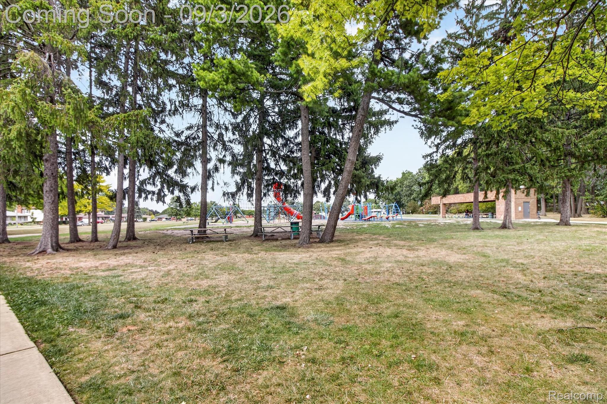 27260 Campbell Road Warren, MI 48093 - Photo 56 of 60 Expansive green space featuring mature trees and a paved walkway