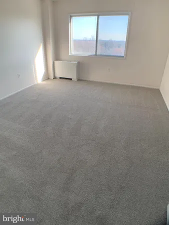 a view of a window in an empty room