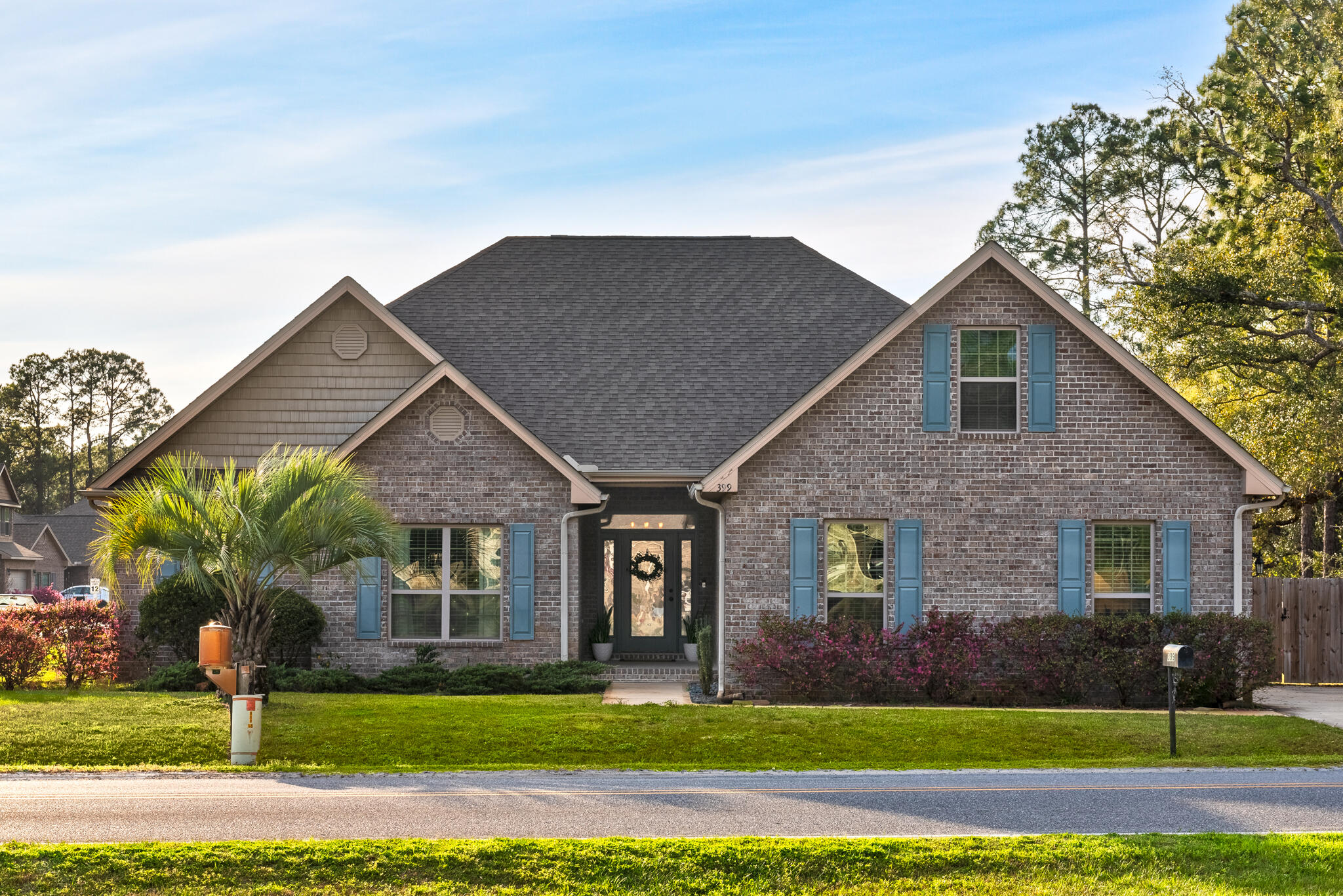 399 Old Ferry Road Santa Rosa Beach, FL 32459 - Photo 1 of 51 a front view of a house with a yard