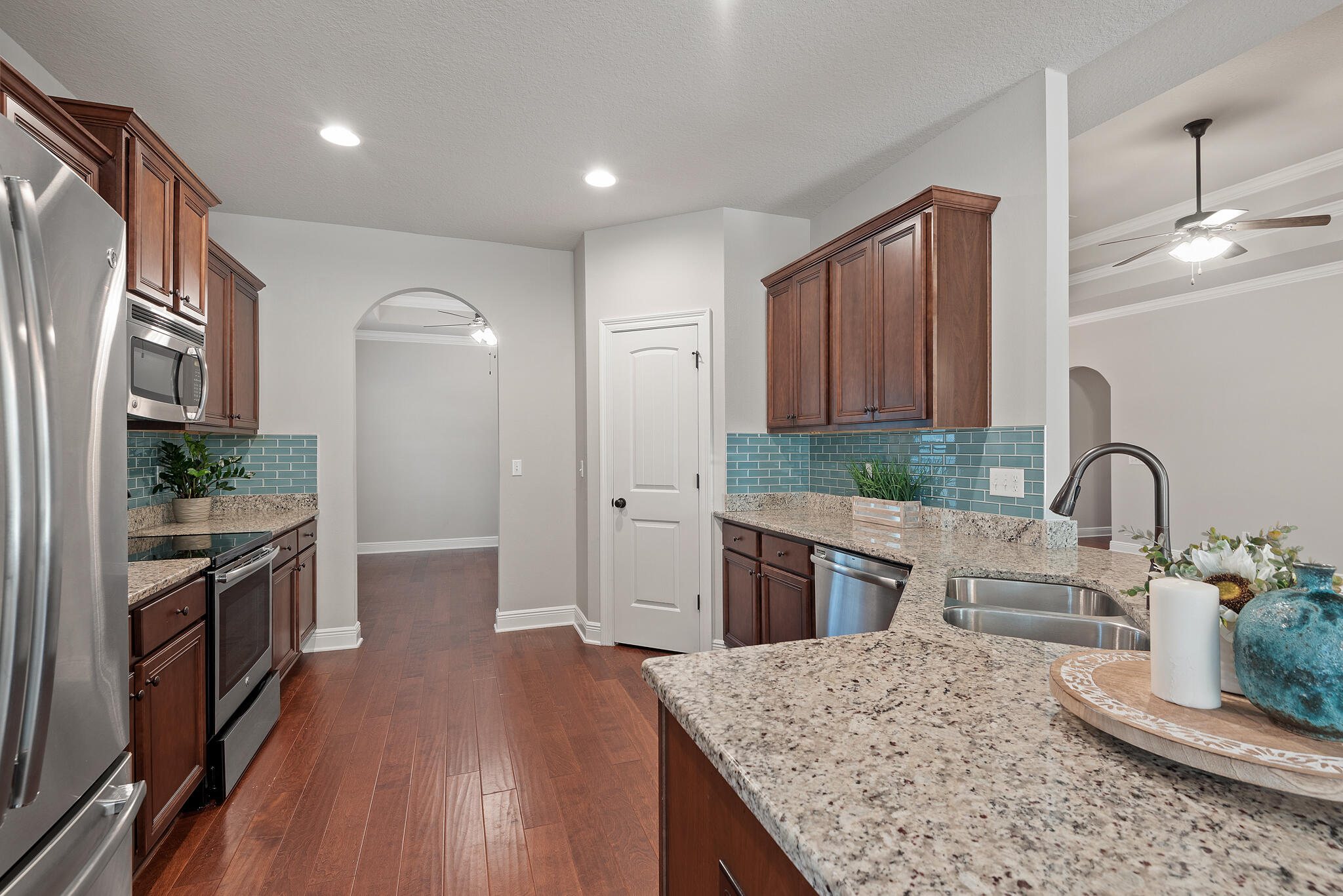 399 Old Ferry Road Santa Rosa Beach, FL 32459 - Photo 13 of 51 a kitchen with stainless steel appliances granite countertop a sink stove and refrigerator