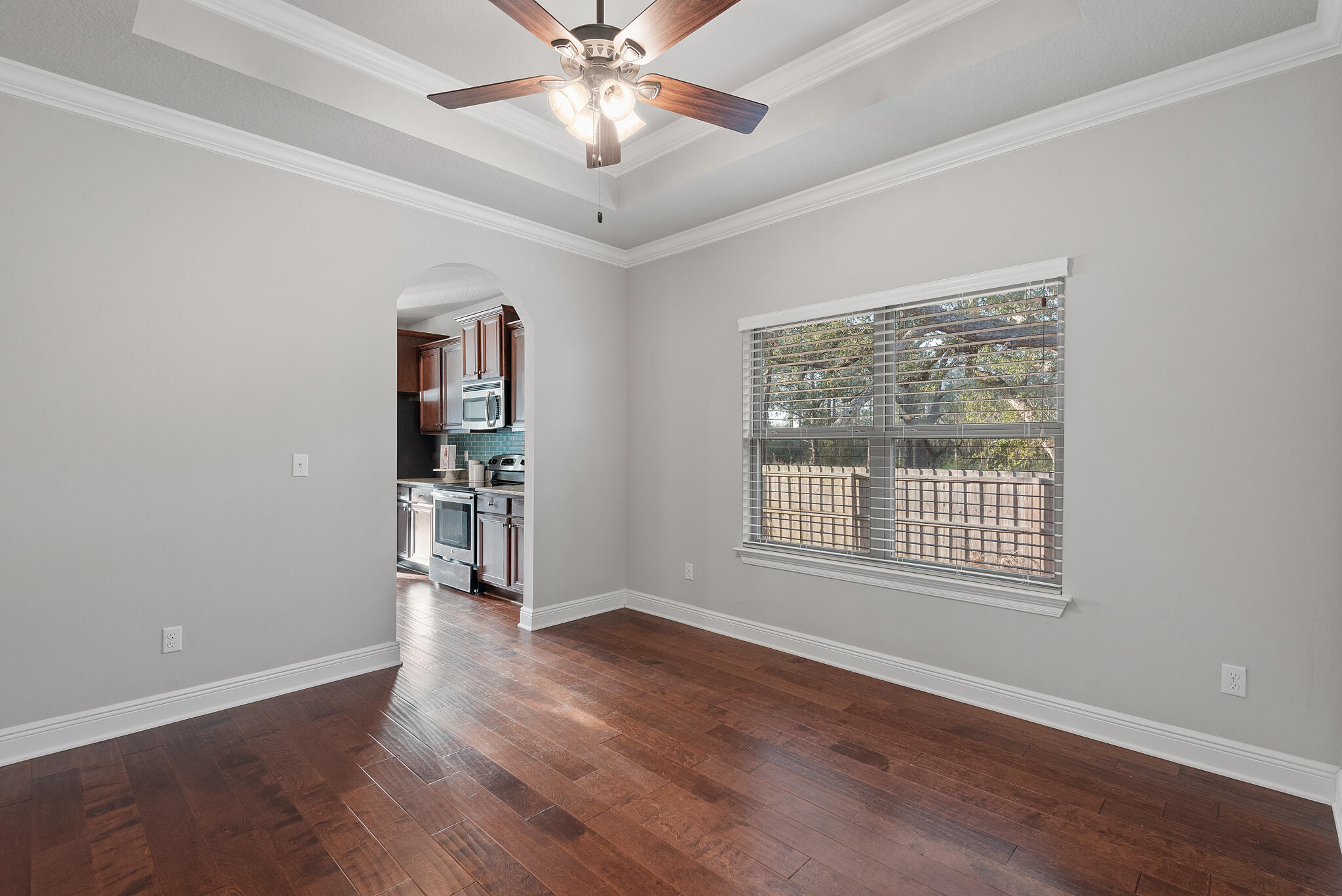 399 Old Ferry Road Santa Rosa Beach, FL 32459 - Photo 17 of 51 a view of an empty room with a window and wooden floor