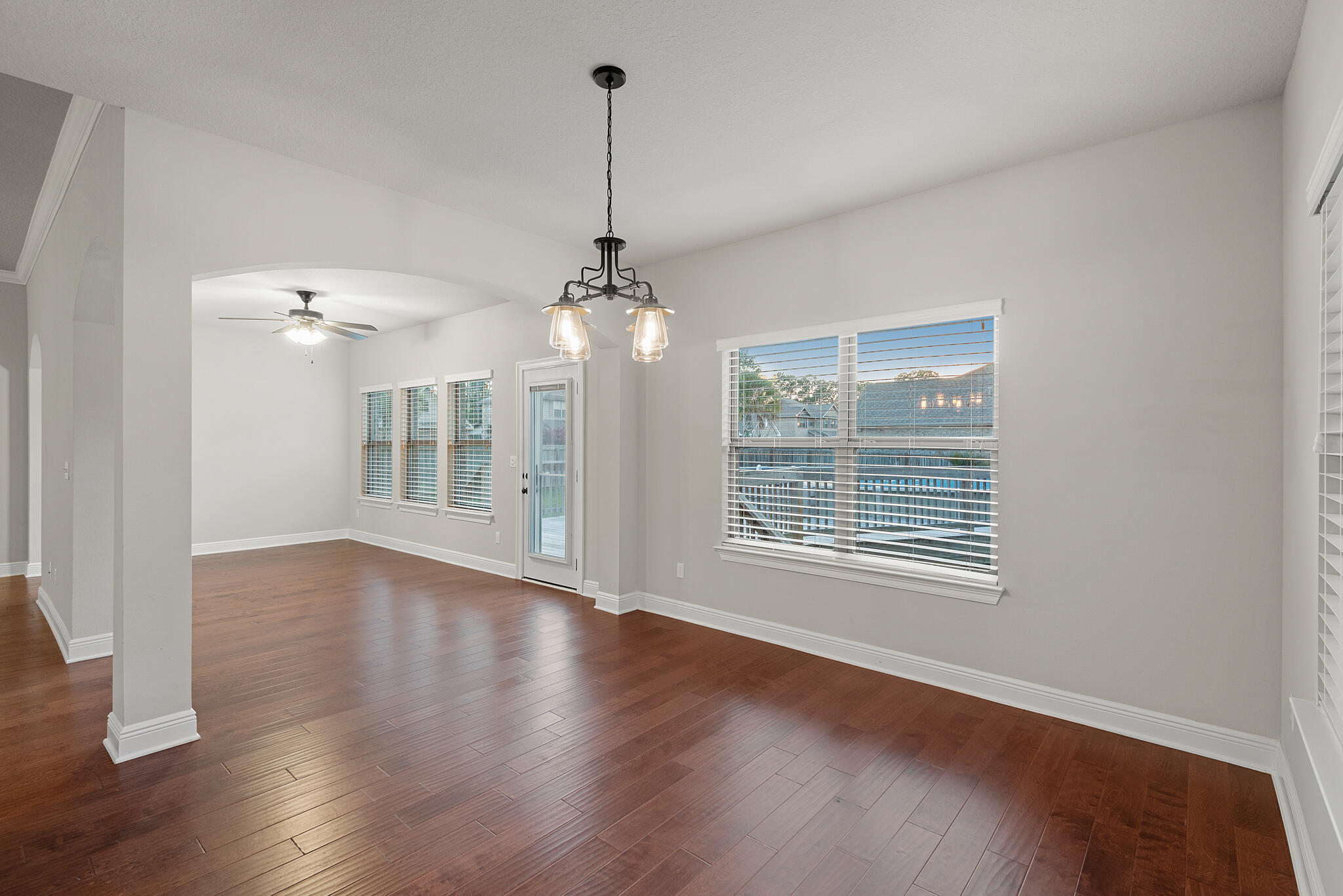 399 Old Ferry Road Santa Rosa Beach, FL 32459 - Photo 19 of 51 a view of an empty room with wooden floor and a window