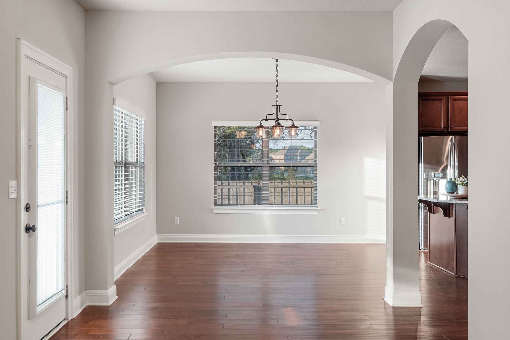 399 Old Ferry Road Santa Rosa Beach, FL 32459 - Photo 21 of 51 a view of an empty room with wooden floor and a window