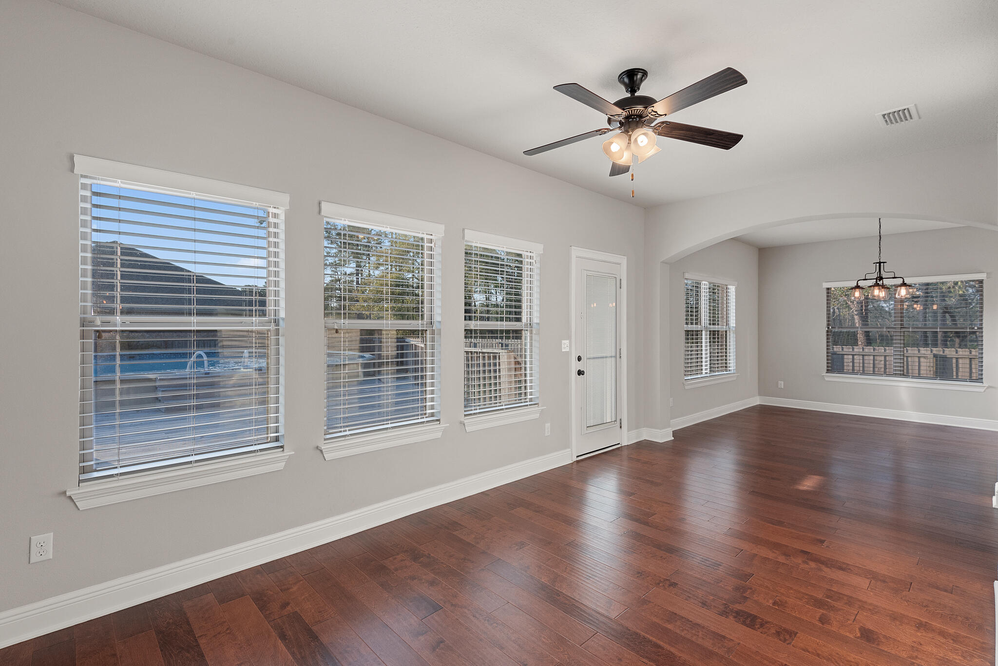 399 Old Ferry Road Santa Rosa Beach, FL 32459 - Photo 22 of 51 a view of an room with wooden floor and ceiling fan