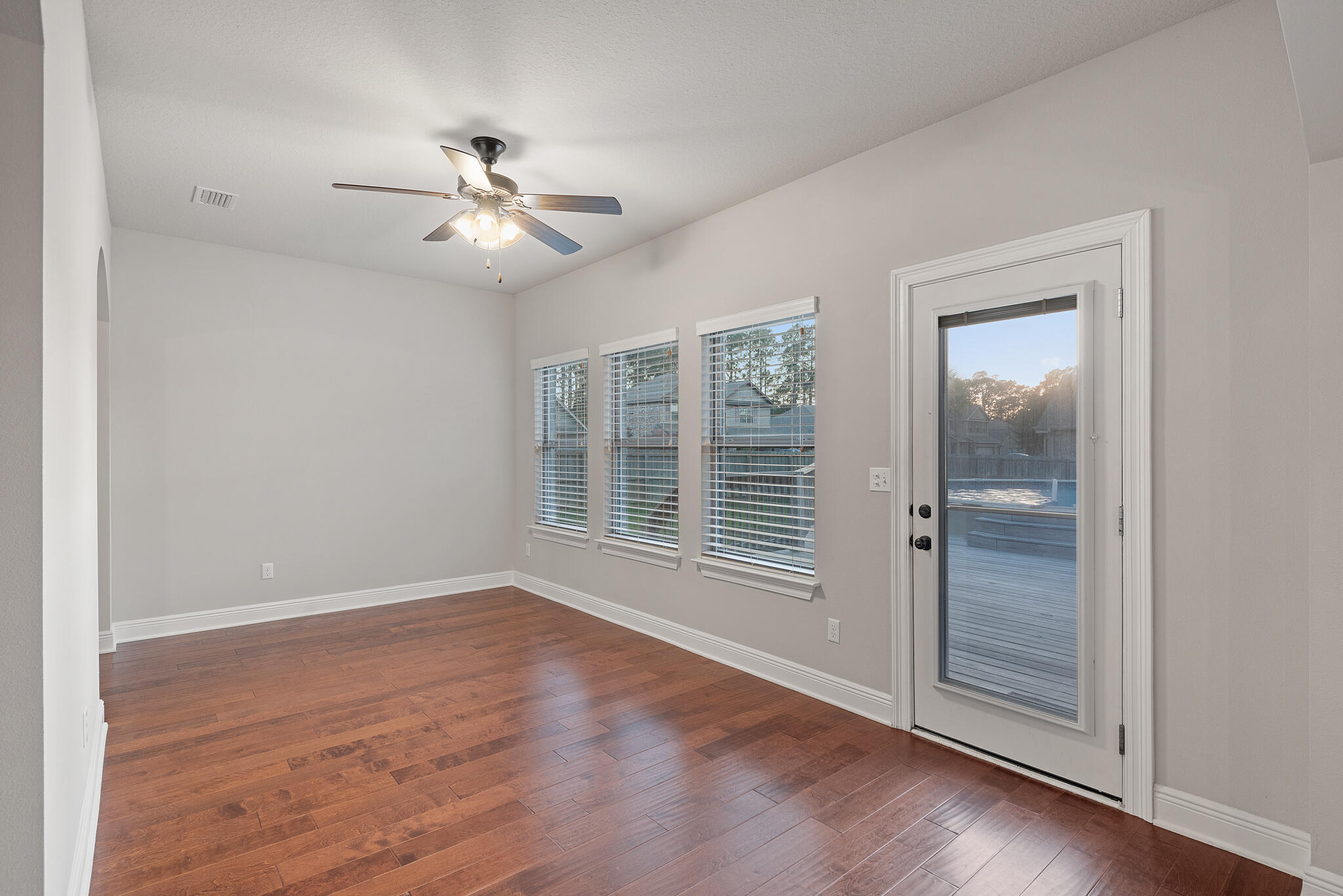 399 Old Ferry Road Santa Rosa Beach, FL 32459 - Photo 23 of 51 a view of empty room with wooden floor and fan