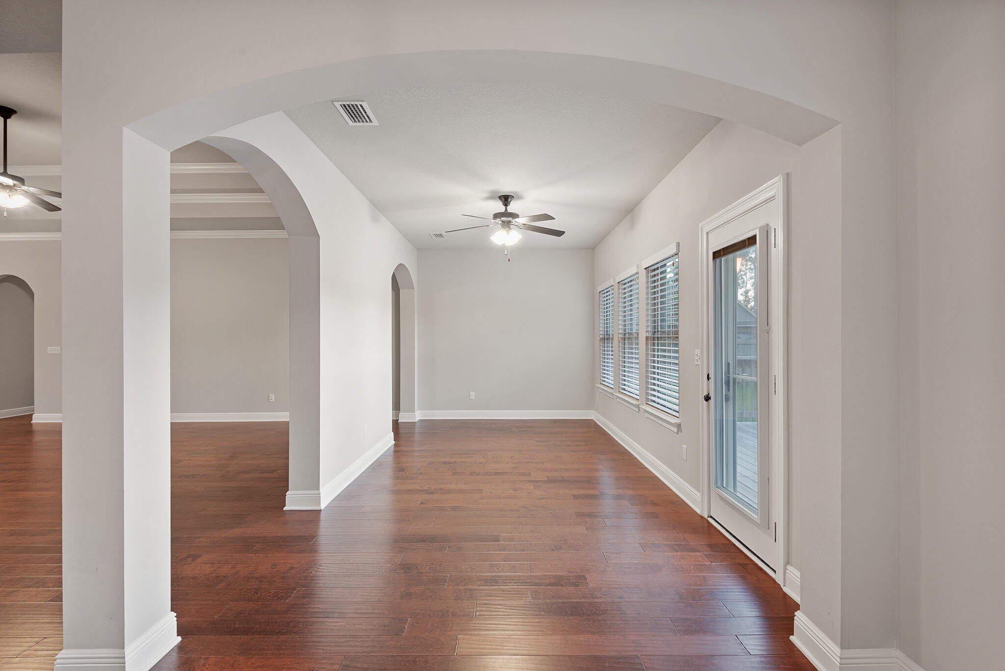 399 Old Ferry Road Santa Rosa Beach, FL 32459 - Photo 24 of 51 a view of a hallway with wooden floor