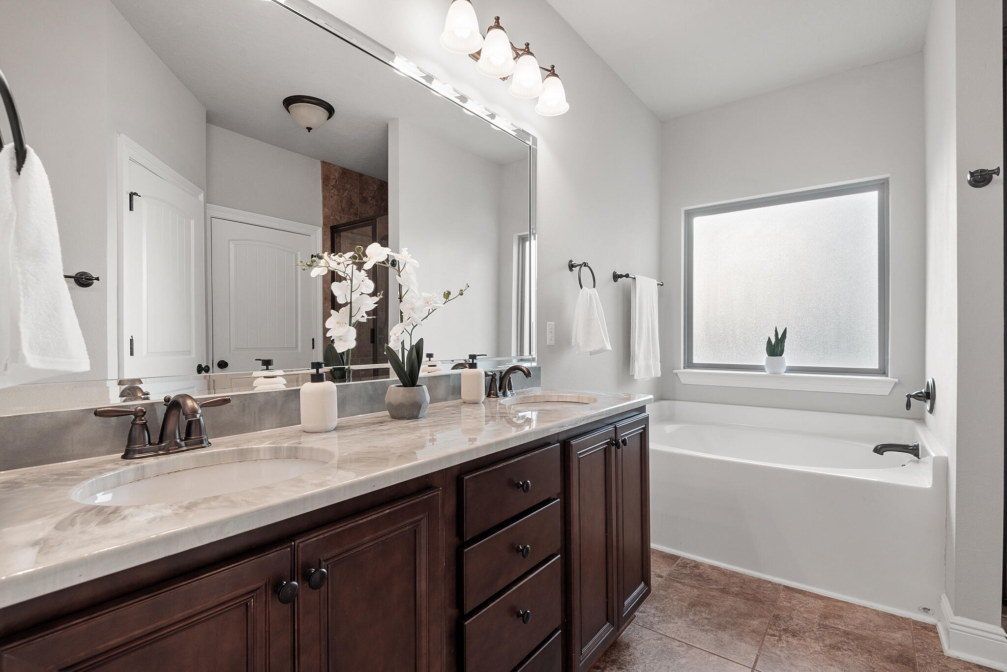 399 Old Ferry Road Santa Rosa Beach, FL 32459 - Photo 29 of 51 a bathroom with a granite countertop sink double vanity granite tub and a mirror
