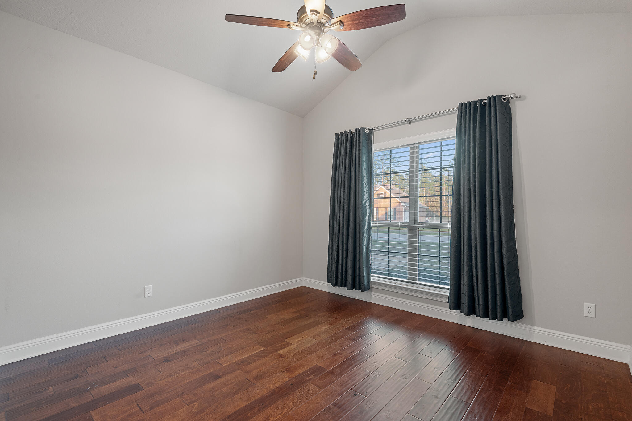 399 Old Ferry Road Santa Rosa Beach, FL 32459 - Photo 35 of 51 a view of an empty room with wooden floor and a window