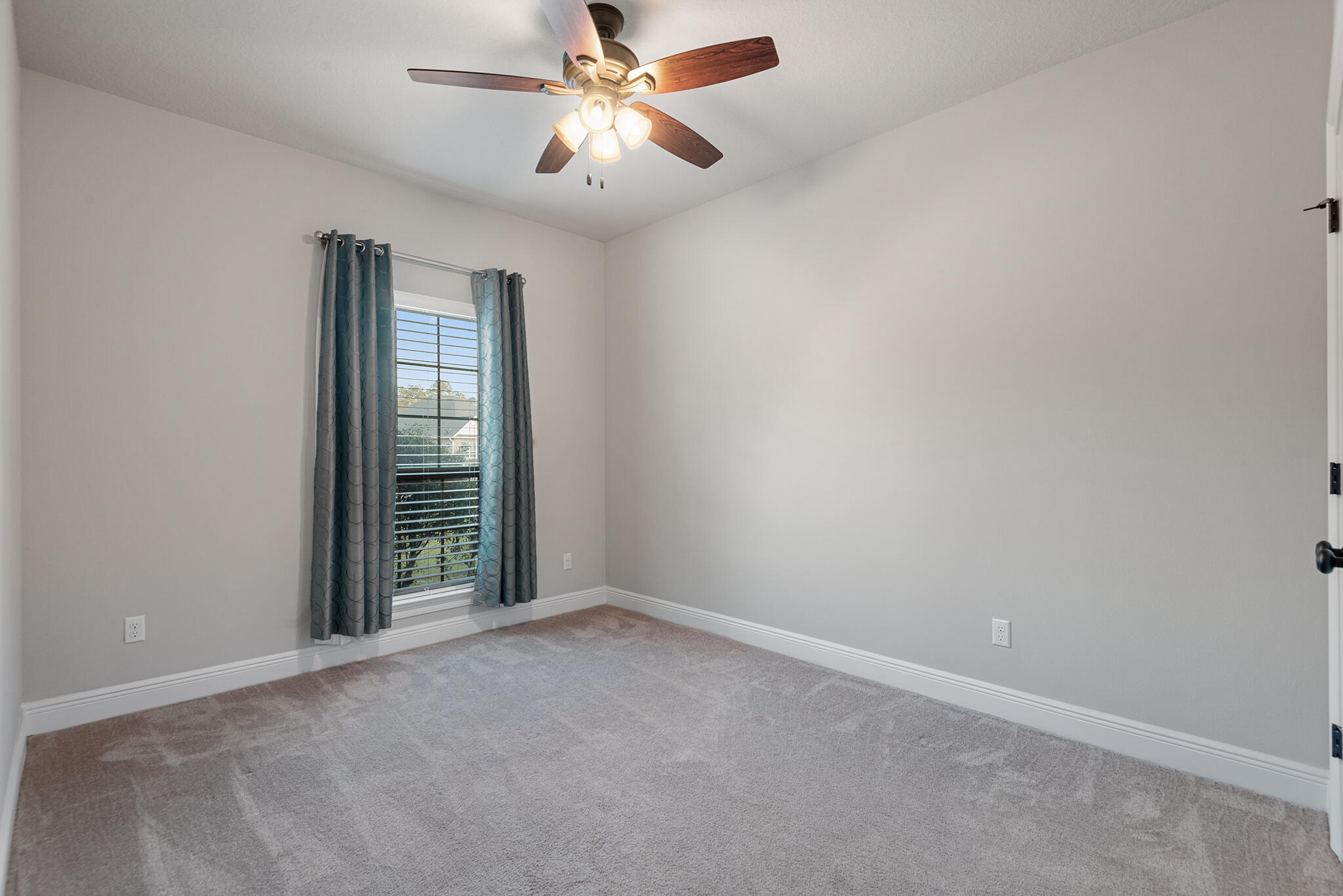 399 Old Ferry Road Santa Rosa Beach, FL 32459 - Photo 37 of 51 an empty room with windows and fan