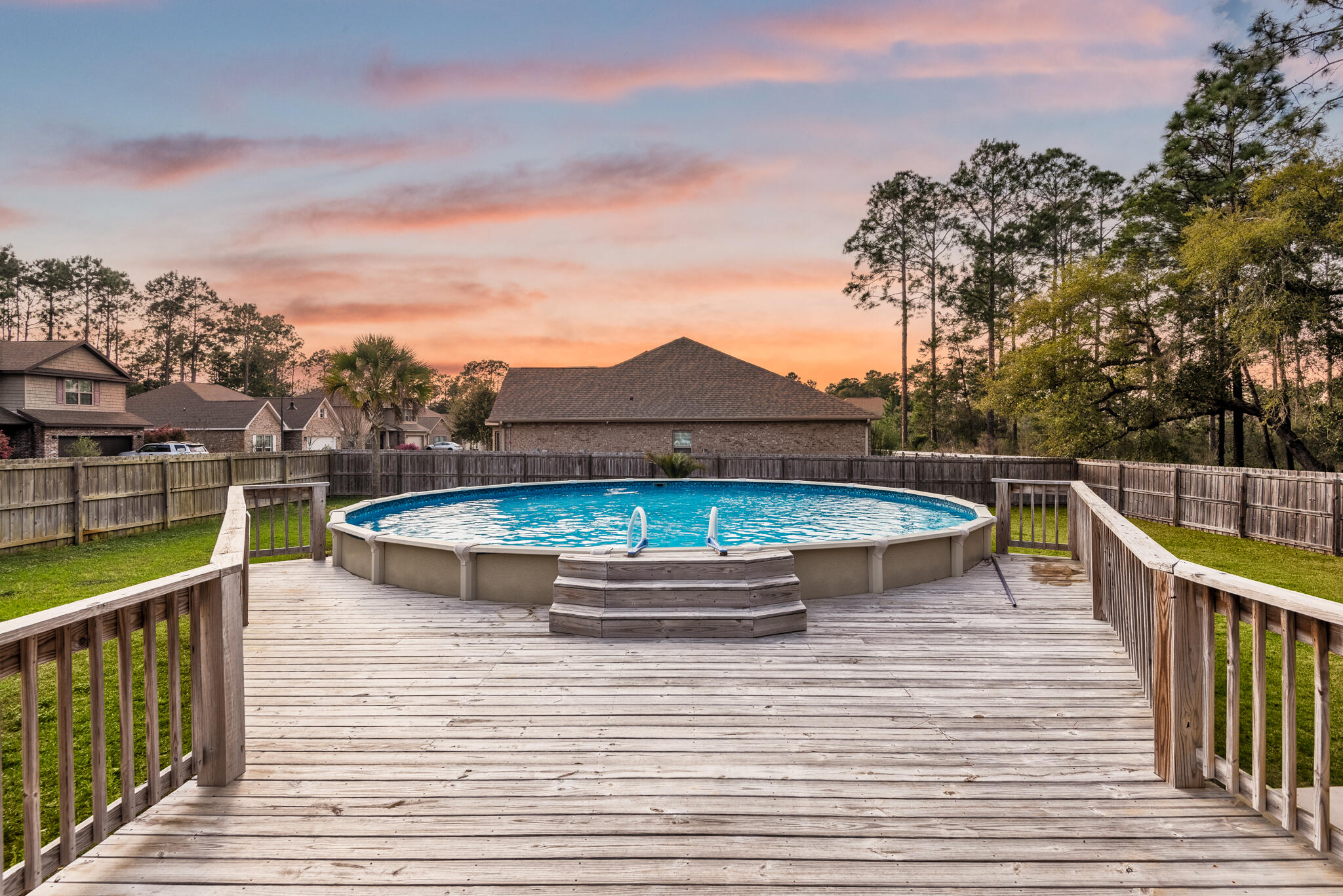 399 Old Ferry Road Santa Rosa Beach, FL 32459 - Photo 43 of 51 a view of a roof deck with chair and wooden floor