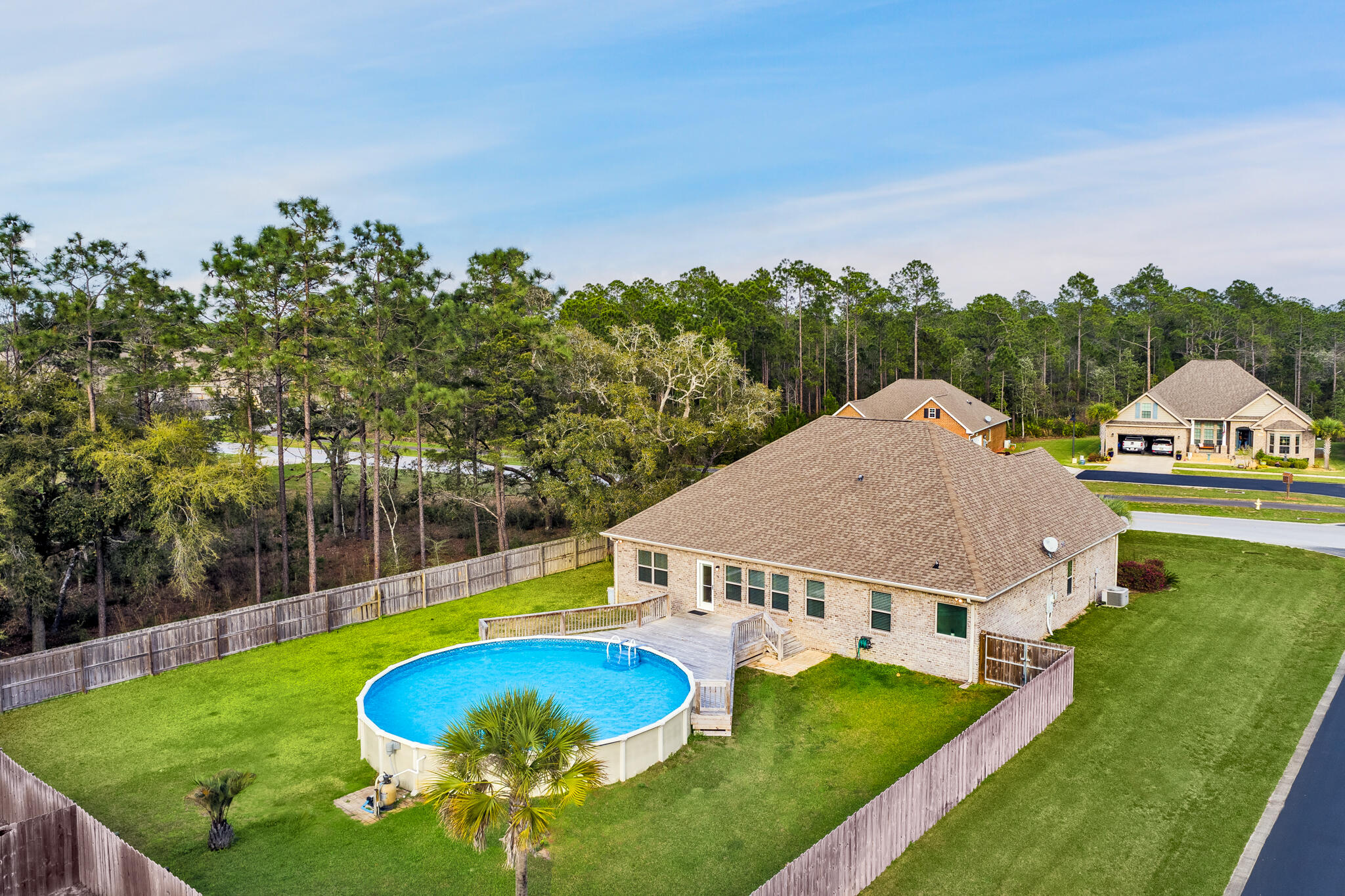 399 Old Ferry Road Santa Rosa Beach, FL 32459 - Photo 51 of 51 a view of a house with swimming pool and yard
