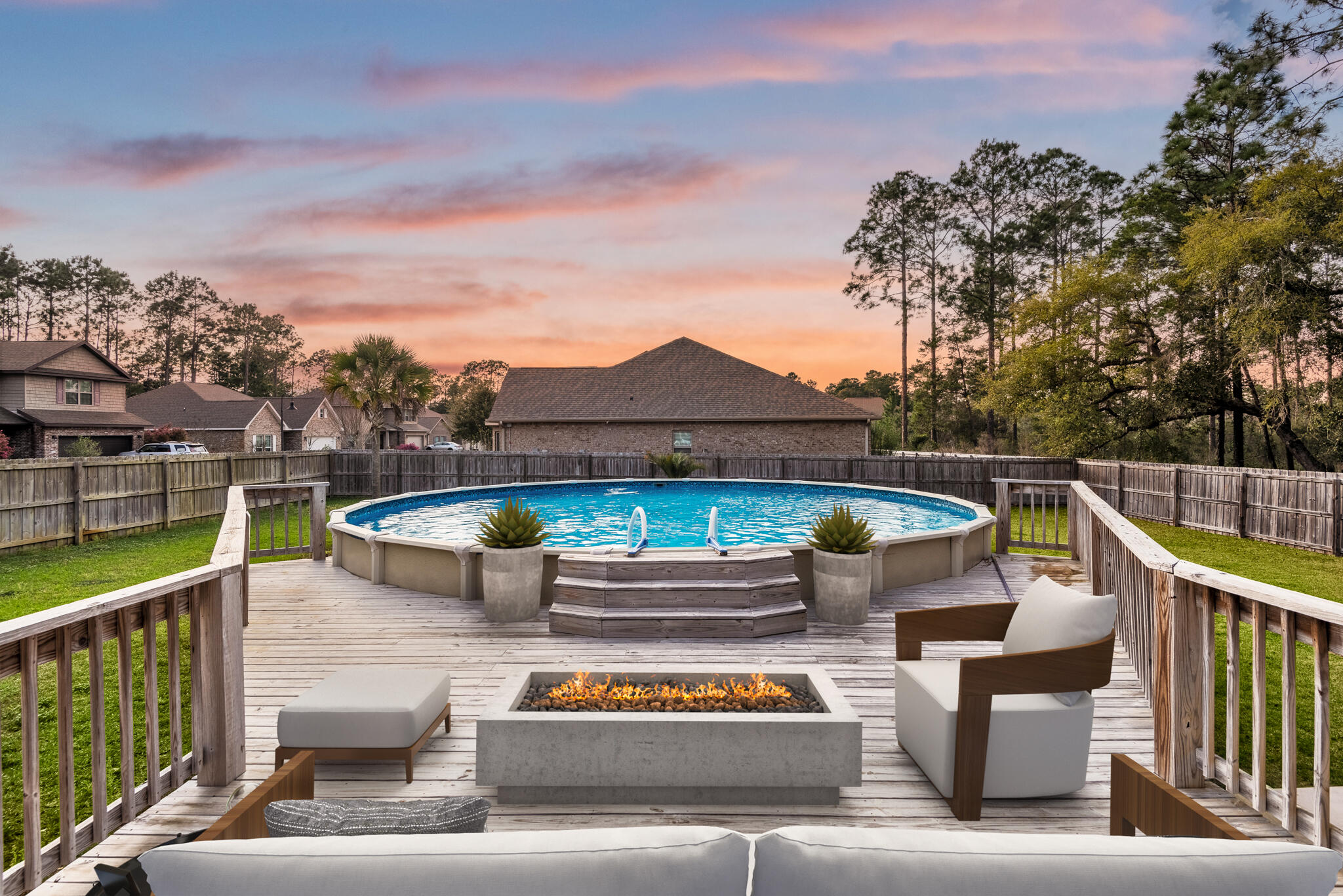 399 Old Ferry Road Santa Rosa Beach, FL 32459 - Photo 6 of 51 a view of a patio with couches chairs under an umbrella