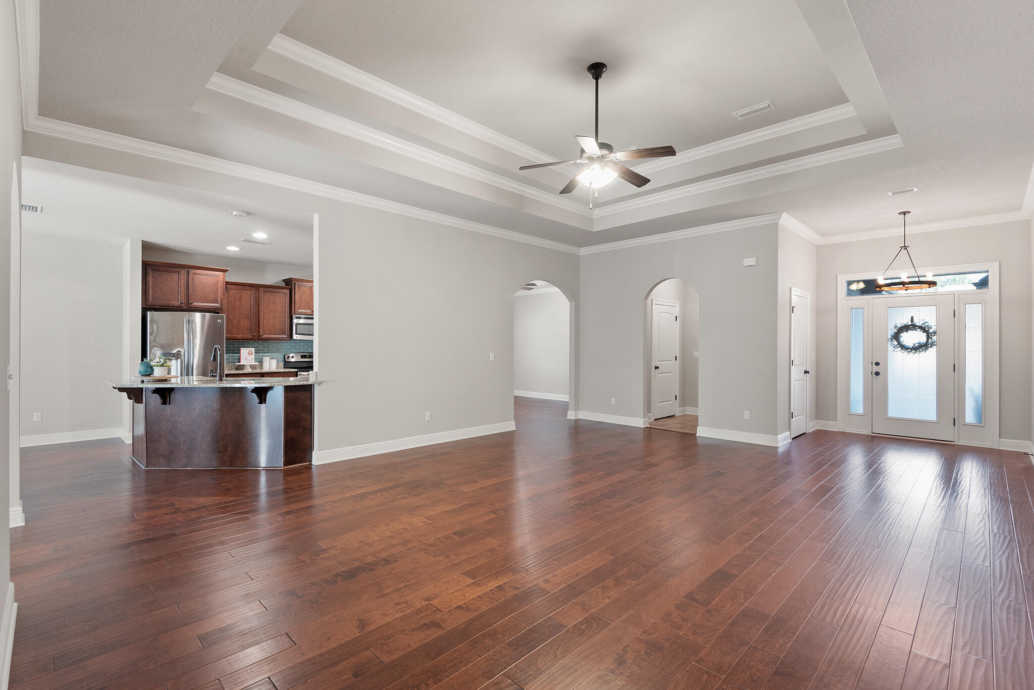 399 Old Ferry Road Santa Rosa Beach, FL 32459 - Photo 8 of 51 a view of an empty room with wooden floor