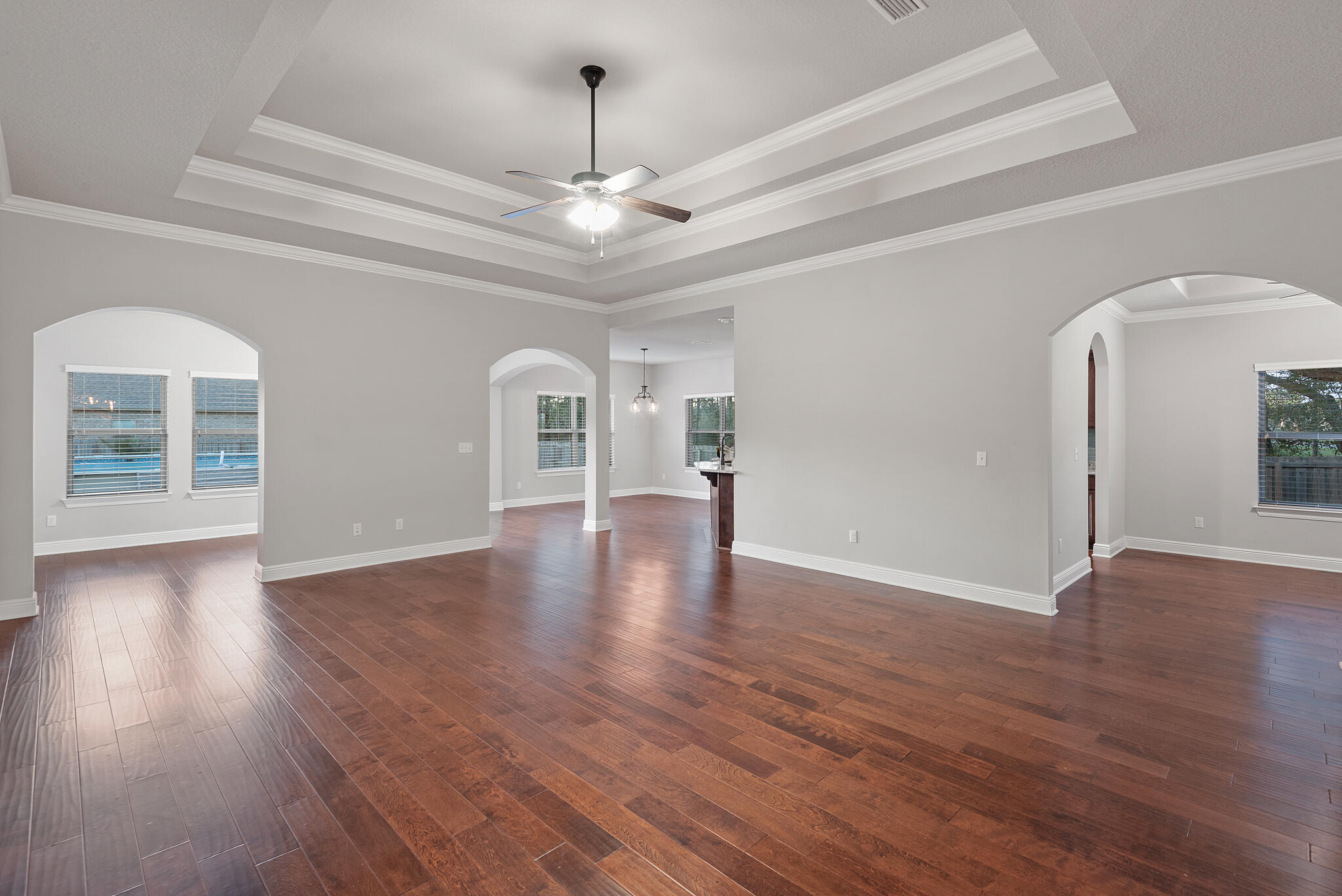 399 Old Ferry Road Santa Rosa Beach, FL 32459 - Photo 9 of 51 a view of an empty room with wooden floor and a window