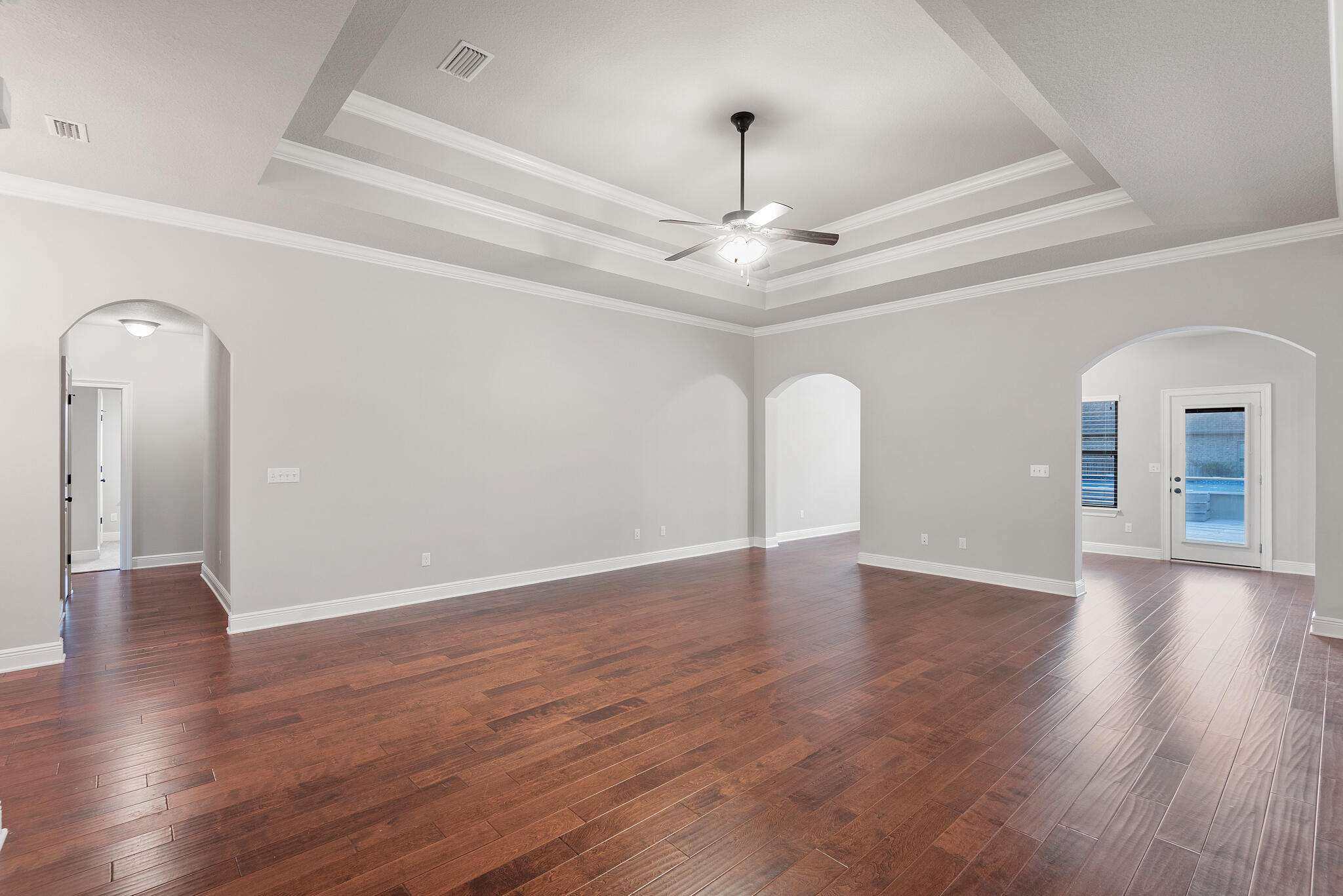 399 Old Ferry Road Santa Rosa Beach, FL 32459 - Photo 10 of 51 a view of an empty room with wooden floor