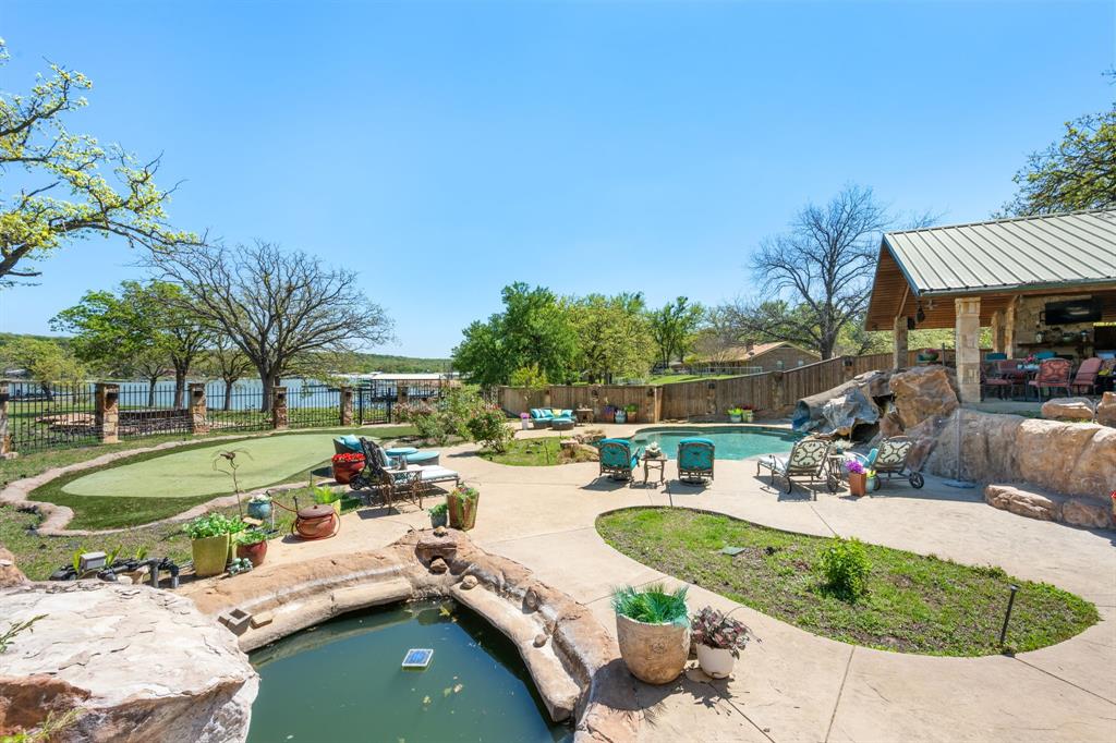 660 Deer Trail Gordon, TX 76453 - Photo 13 of 40 a view of a swimming pool with a patio