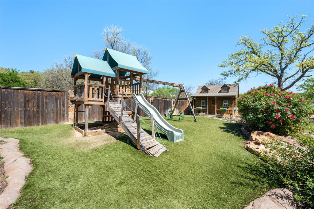 660 Deer Trail Gordon, TX 76453 - Photo 20 of 40 a view of a house with backyard and a slide