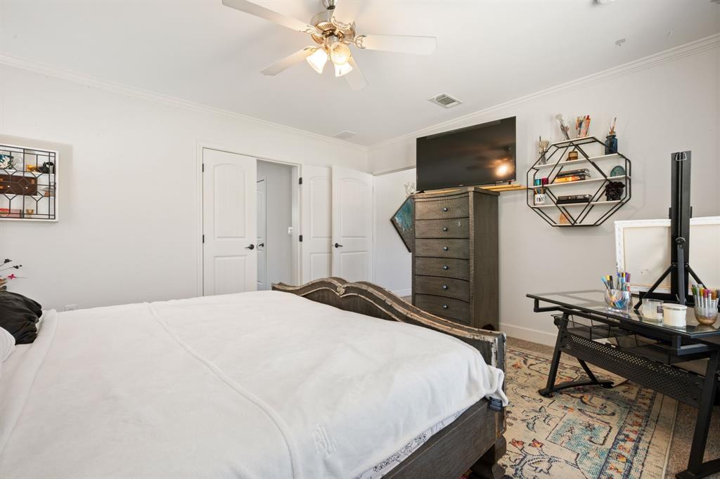 660 Deer Trail Gordon, TX 76453 - Photo 26 of 40 a bedroom with a bed and a chandelier