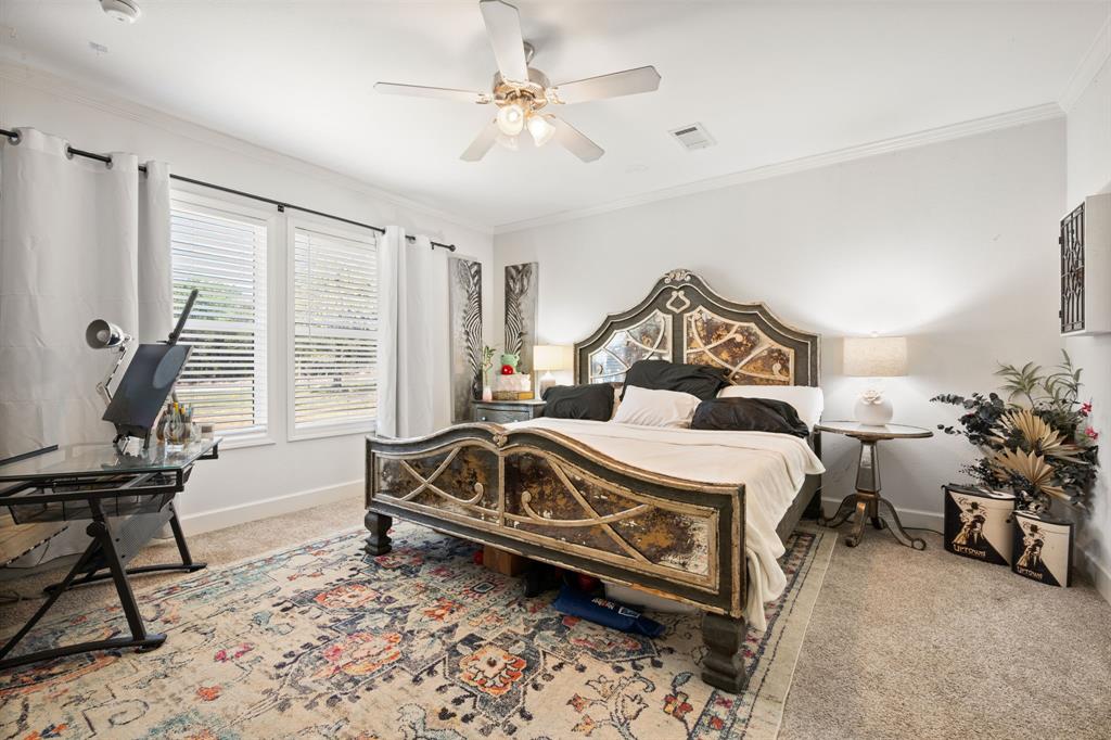 660 Deer Trail Gordon, TX 76453 - Photo 10 of 40 a bedroom with a bed and a chandelier