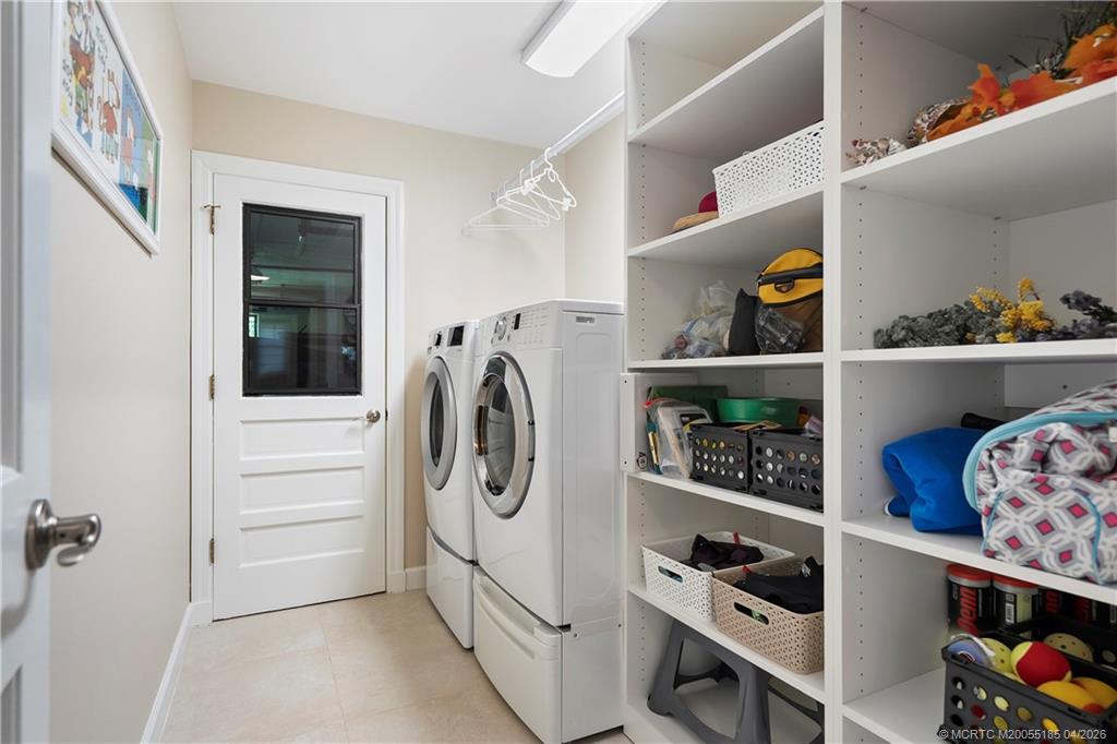 4620 Southeast Quail Trail Stuart, FL 34997 - Photo 21 of 71 a view of walk in closet with clothes and shoes