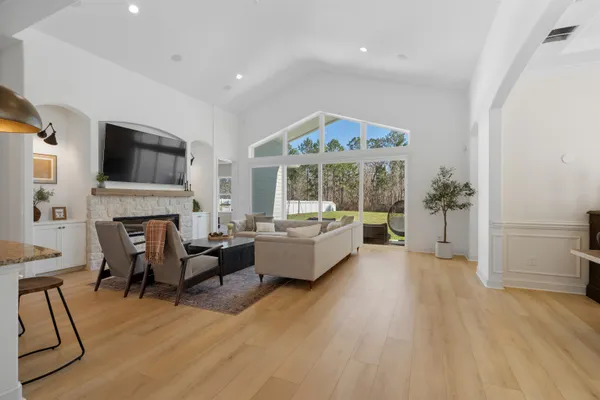 a kitchen with stainless steel appliances granite countertop a sink a refrigerator and a stove