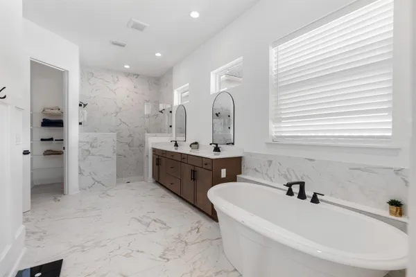 a bathroom with a bathtub and toilet
