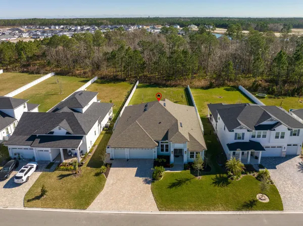 an aerial view of a house with a ocean view