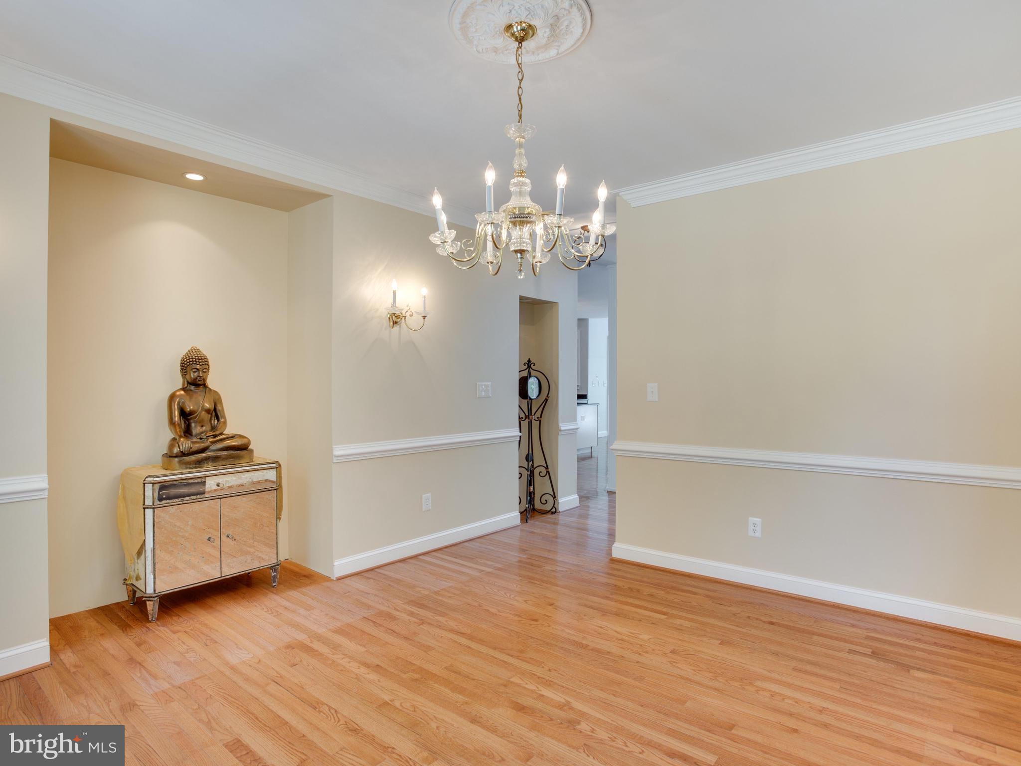 41161 Knight Road Leonardtown, MD 20650 - Photo 17 of 109 Dining Rm w/Wood Floors, Crown & Chair