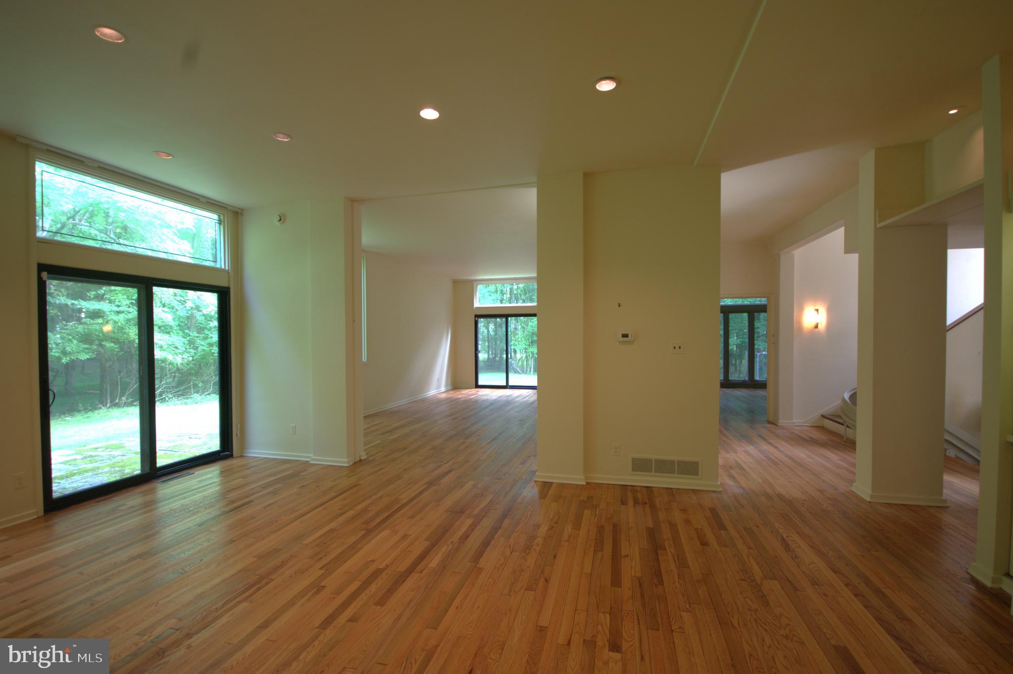 120 South Devon Avenue Devon, PA 19333 - Photo 4 of 4 a view of an empty room with wooden floor and a window