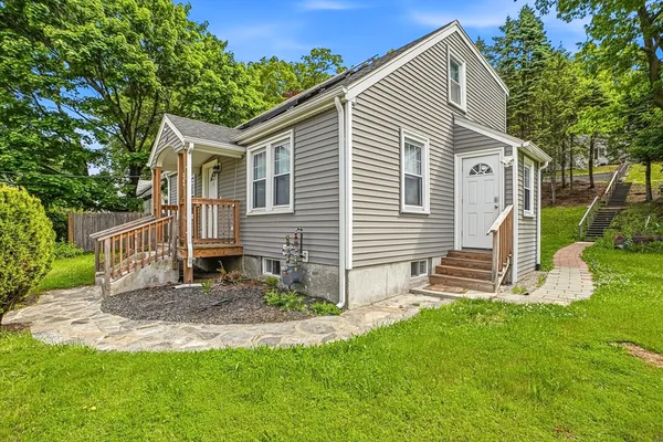 a front view of a house with a yard