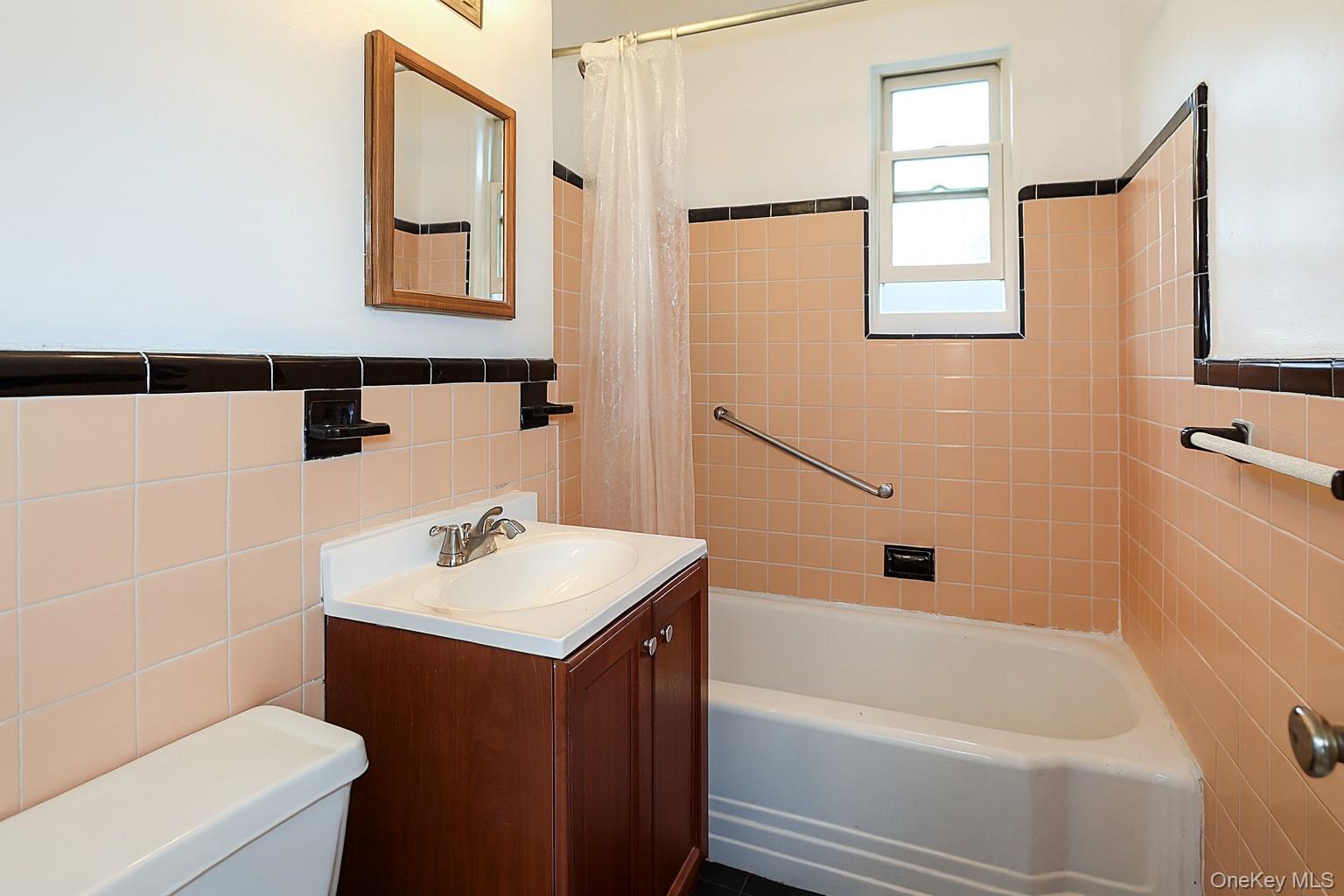 10 Glen Keith Road, Unit U Glen Cove, NY 11542 - Photo 16 of 22 a bathroom with a sink toilet and shower