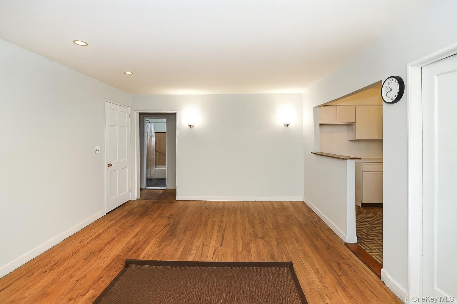 10 Glen Keith Road, Unit U Glen Cove, NY 11542 - Photo 8 of 22 a view of a room with wooden floor and entryway