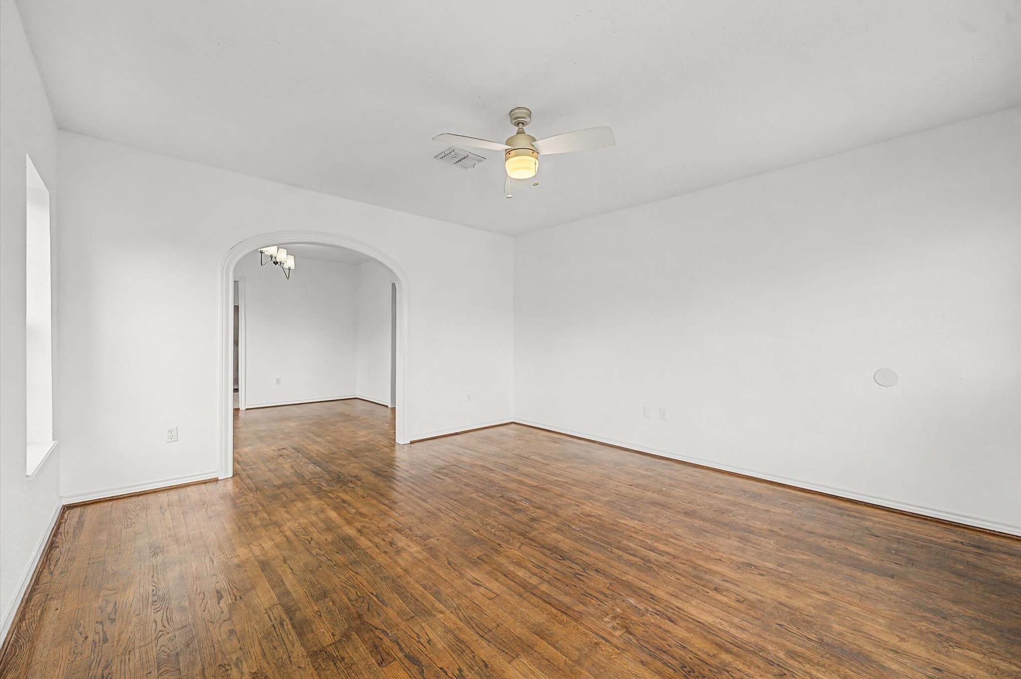 511 Joyce Street Houston, TX 77009 - Photo 5 of 17 a view of empty room with wooden floor