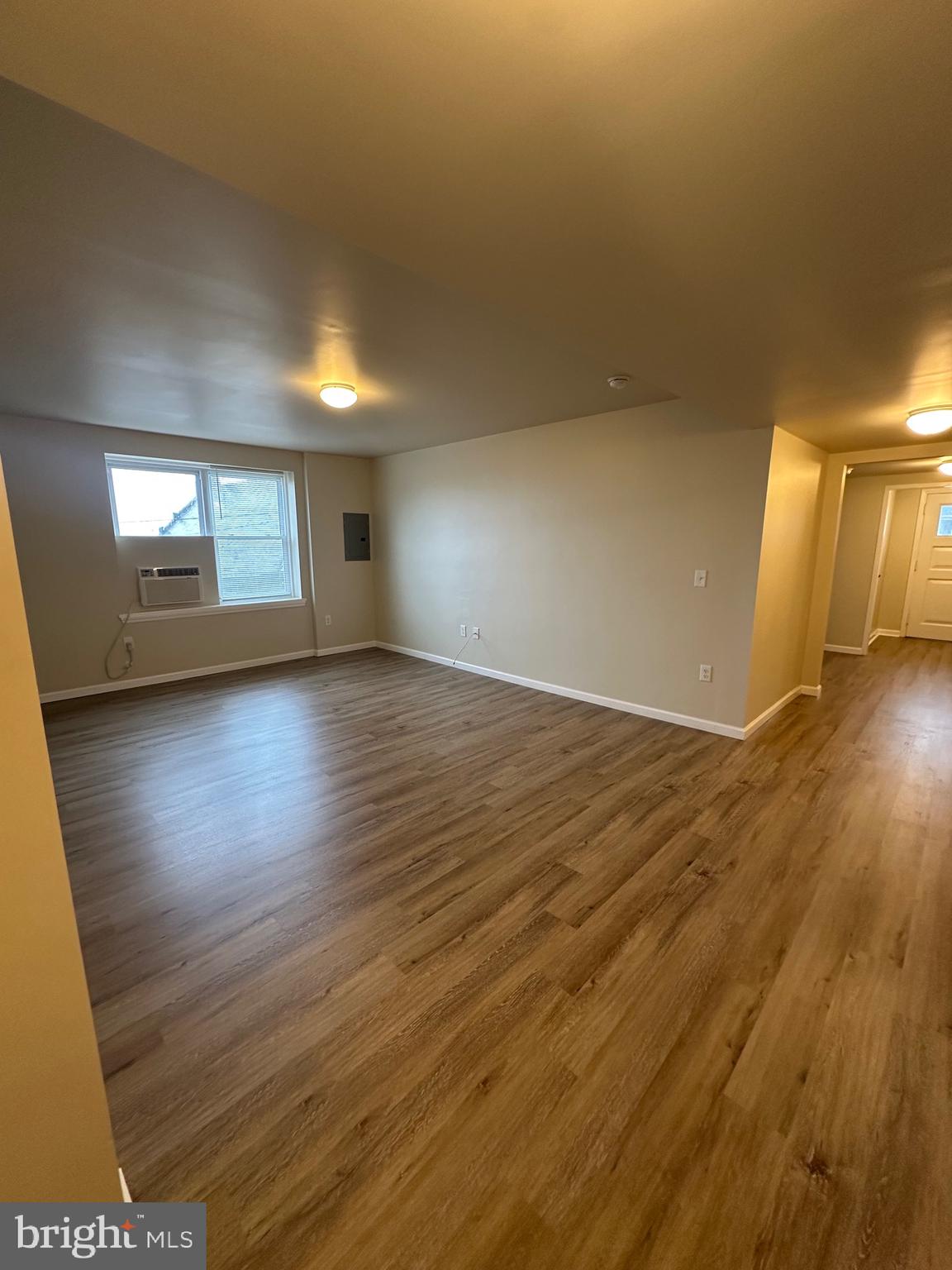 122 East Ridge Road, Unit A4 Marcus Hook, PA 19061 - Photo 2 of 11 an empty room with wooden floor and windows