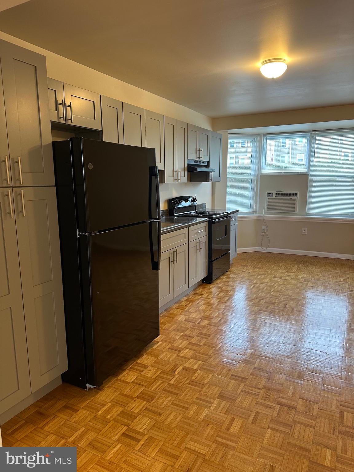 122 East Ridge Road, Unit A4 Marcus Hook, PA 19061 - Photo 4 of 11 a kitchen with granite countertop a refrigerator and a sink