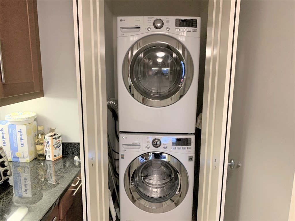 1 Charles Street South, Unit 807 Boston, MA 02116 - Photo 12 of 28 a view of a kitchen with washer and dryer