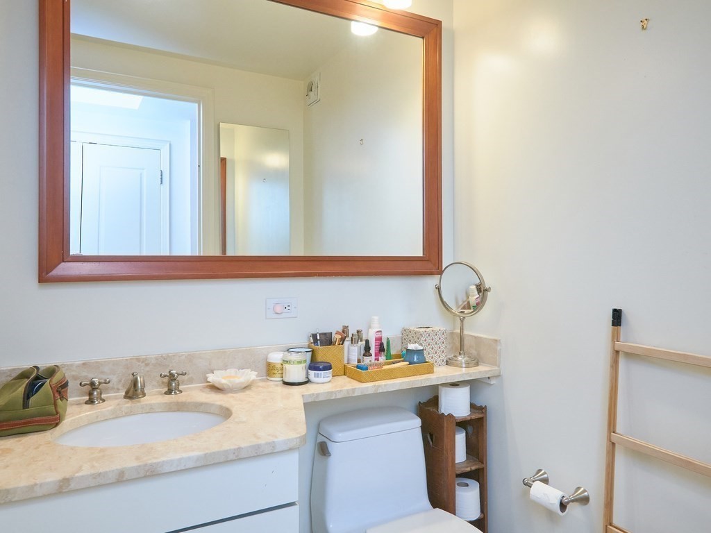 1 Charles Street South, Unit 807 Boston, MA 02116 - Photo 13 of 28 a bathroom with a sink and a mirror