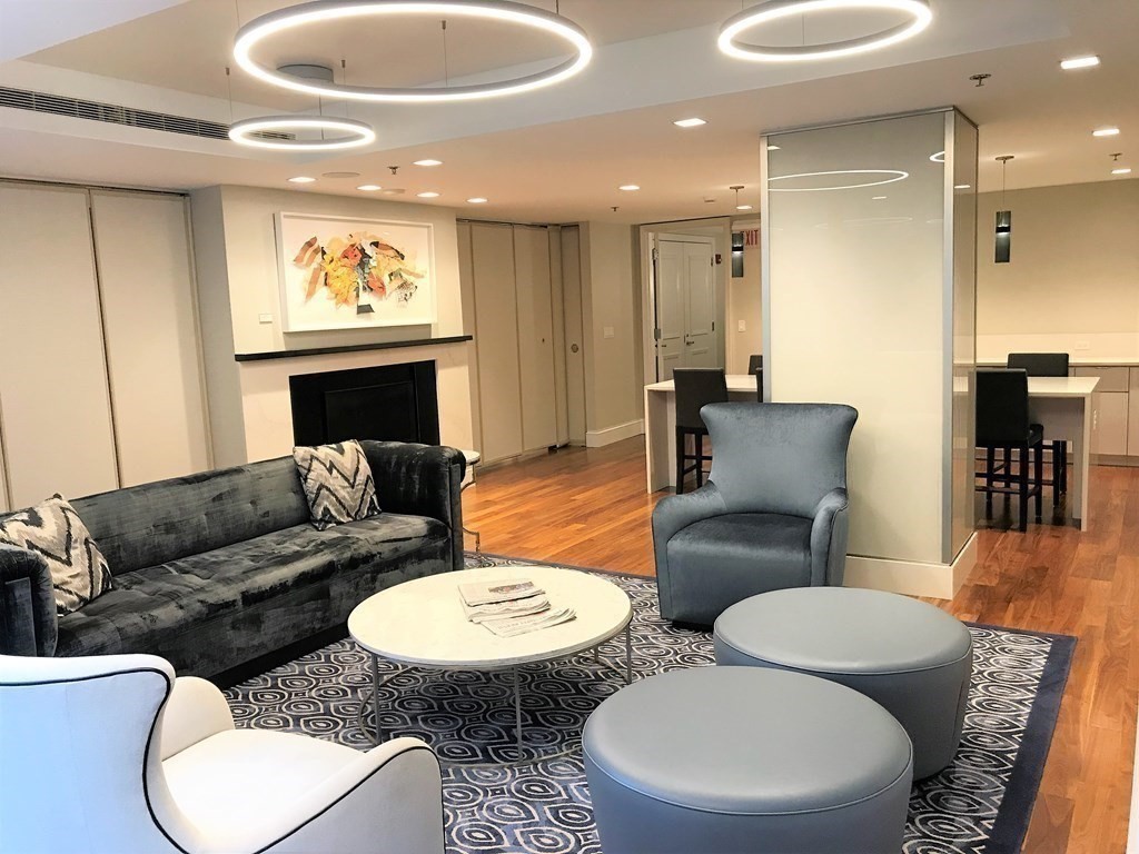 1 Charles Street South, Unit 807 Boston, MA 02116 - Photo 17 of 28 a living room with furniture and a glass door