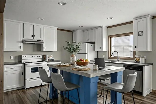 a view of a room with wooden floor and a bathroom