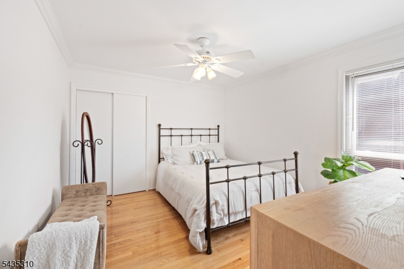 488 Auten Road, Unit 2D Hillsborough, NJ 08844 - Photo 18 of 30 a bedroom with a bed and a chandelier
