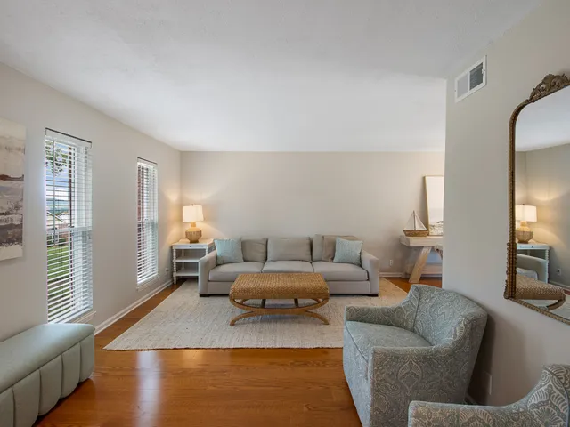 a living room with a table and chairs