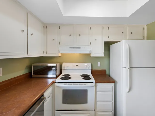 an empty room with a empty space and windows