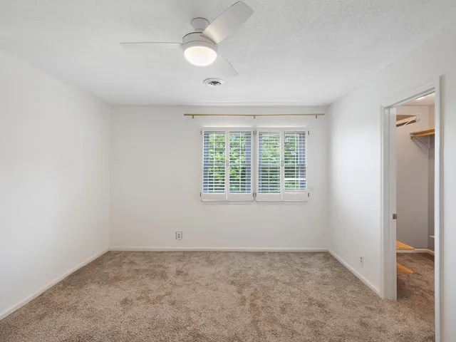 a bathroom with a bathtub shower vanity and a sink