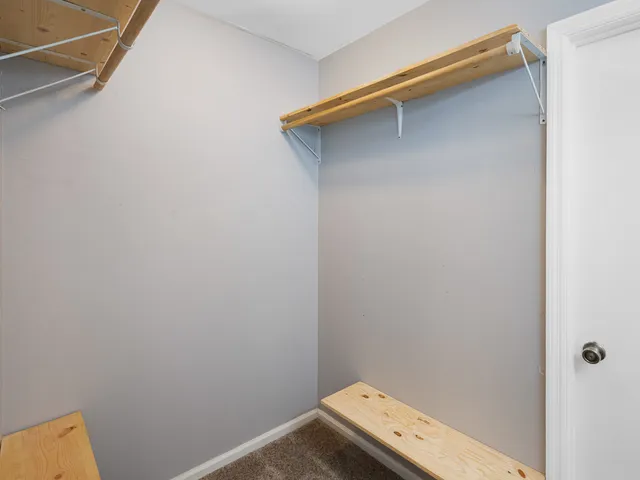 a bedroom with bed and window