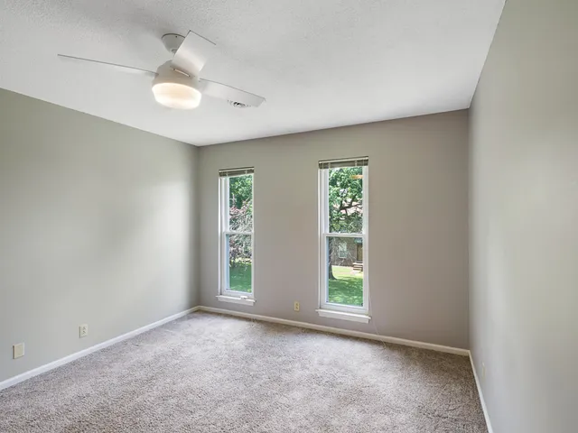 a view of a house with wooden deck