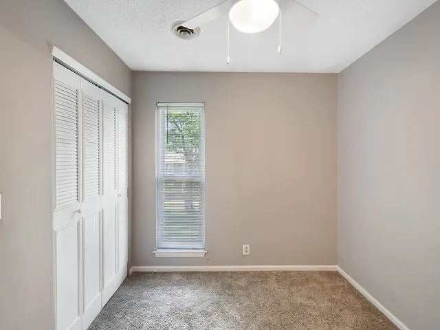 a view of a balcony with wooden floor and city view